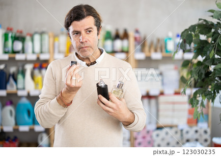 Adult man chooses perfume in store 123030235