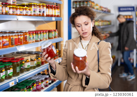 Adult woman chooses lecho in store 123030361