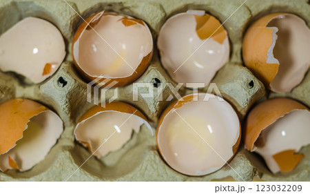Texture of broken empty eggshell in carton box. View from above. High quality photo Texture of broken empty eggshell in carton box. View from above. High quality photo 123032209