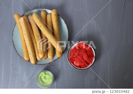 Sausages with red white sauce on a gray background, top view, shooting of breakfast products in the studio. The concept of a homemade breakfast snack 123033482