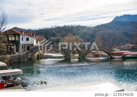 Arched bridge over Crnojevic river in small town near Skadar lake in Montenegro in winter time Arched bridge over Crnojevic river in small town near Skadar lake in Montenegro in winter time 123034826