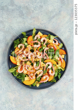 Fresh persimmon seafood salad. Fresh persimmon seafood salad. 123035375