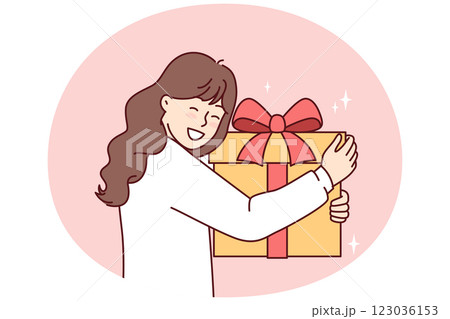 Teenage girl with big gift box with red ribbon smiling overjoyed at unexpected surprise 123036153