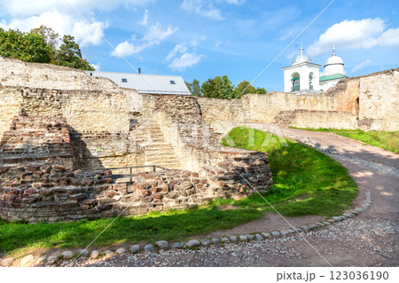 Rough stone walls and tower of the Izborsk fortress, Izborsk, Pskov region, Russia. Medieval castle of the 14th century Rough stone walls and tower of the Izborsk fortress, Izborsk, Pskov region, Russia. Medieval castle of the 14th century 123036190