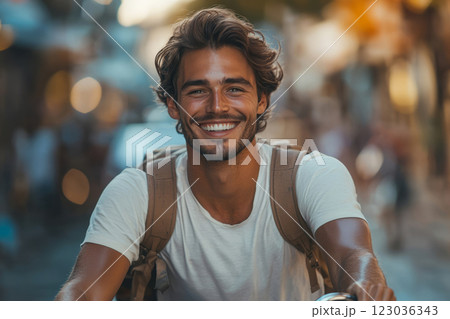 Smiling Man Riding Bicycle in City Street 123036343