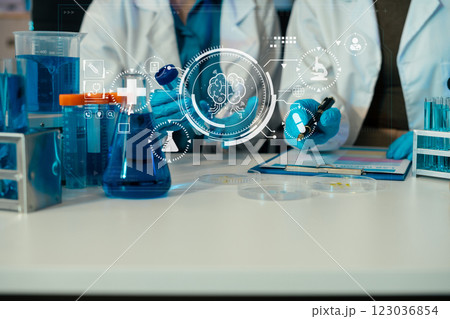 Science and medicine, scientist analyzing and dropping a sample into a glassware, experiments containing chemical liquid in laboratory on glassware, innovative and technology. 123036854
