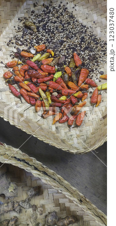 Red Chilies and Peppercorns in Baskets, Spice Photography in Bali, Indonesia Red Chilies and Peppercorns in Baskets, Spice Photography in Bali, Indonesia 123037480