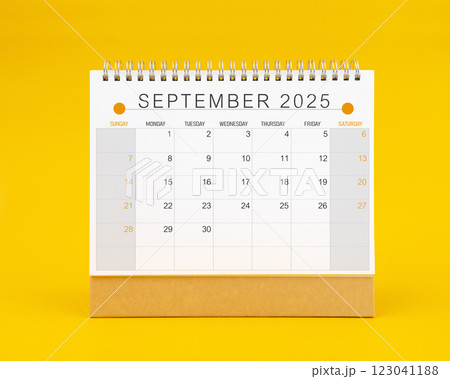 September 2025 desk calendar on yellow color background. September 2025 desk calendar on yellow color background. 123041188