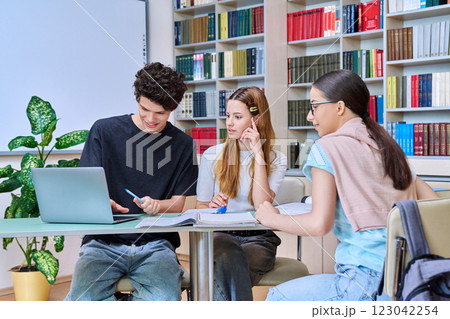 Group of college students are studying in library class 123042254