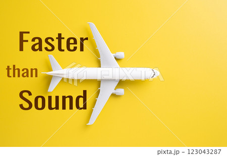 Passenger plane and the slogan Faster than Sound. Supersonic flights and rapid air travel. Aviation innovation, air transportation, future airline technology. Passenger plane and the slogan Faster than Sound. Supersonic flights and rapid air travel. Aviation innovation, air transportation, future airline technology. 123043287