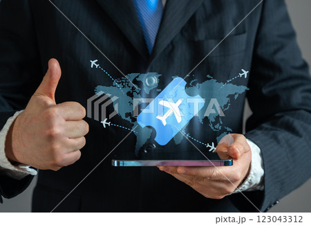 Businessman booking air tickets. Flight booking purchase services. Business trips. Flight schedules management. Online travel reservations. Businessman booking air tickets. Flight booking purchase services. Business trips. Flight schedules management. Online travel reservations. 123043312