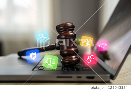 Judge's hammer on a laptop. Legal assistance. Legislative regulation of digital systems, cyberspace and Internet technologies. Data protection, online privacy, and internet legislation. 123043324