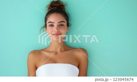 Elegant woman in a white dress posing for the camera timeless fashion and beauty 123045674