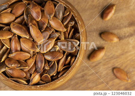 , overcooked or burnt pumpkin seeds on the table , overcooked or burnt pumpkin seeds on the table 123046032