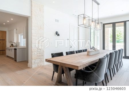 Modern farmhouse dining room with large wooden table 123046603
