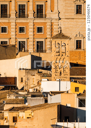 Views of Toledo historic architecture and aged tower bathed in the warm glow of the setting sun. 123046674