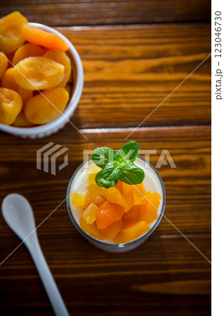 Diet breakfast with milk yogurt and dried apricots Diet breakfast with milk yogurt and dried apricots 123046730