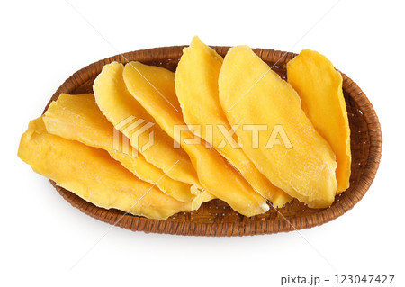 dried mango in a wicker basket isolated on white background. Top view. Flat lay. dried mango in a wicker basket isolated on white background. Top view. Flat lay. 123047427