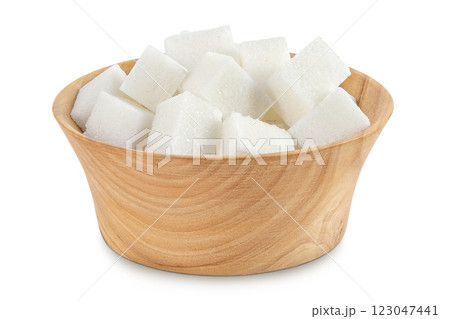 Sugar cubes in a wooden bowl isolated on white background Sugar cubes in a wooden bowl isolated on white background 123047441