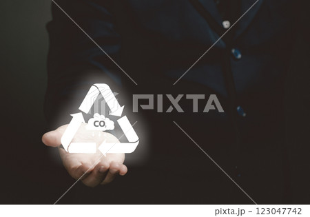man hold the co2 icon in hand. air pollution concept.responsibility and impact air sustainability world resource, warming, climate change, efficiency, global warming, renewable, sustainable. 123047742