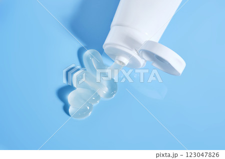Gel toothpaste in a tube on a blue background. 123047826