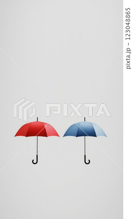two bright open umbrellas in red and blue placed together against white background with ample copyspace concept of weather brand insurance marketing 123048865
