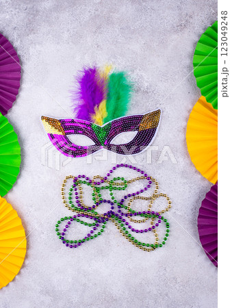 Vibrant Mardi Gras background with mask, beads, and festive decorations 123049248