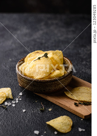 Crispy salty homemade potato chips Crispy salty homemade potato chips 123049285
