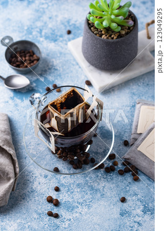 Freshly brewed drip coffee in glass cup Freshly brewed drip coffee in glass cup 123049295