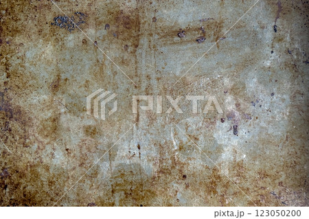 Burnt metal surface with rust stains. Corroded damaged dirty texture and distressed details. Industrial grunge background. Abstract backdrop. Close up Burnt metal surface with rust stains. Corroded damaged dirty texture and distressed details. Industrial grunge background. Abstract backdrop. Close up 123050200