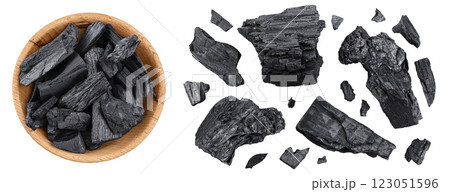 Natural charcoal in wooden bowl isolated on white background with full depth of field. Top view. Flat lay Natural charcoal in wooden bowl isolated on white background with full depth of field. Top view. Flat lay 123051596