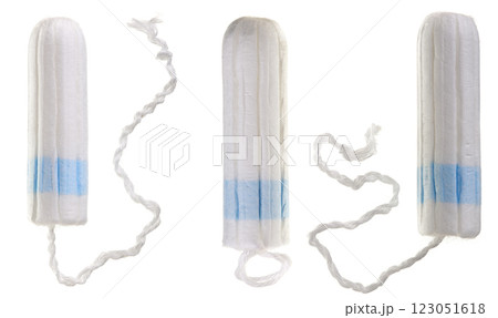 A new tampon with blue string to absorb menstrual blood isolated on white background. Top view A new tampon with blue string to absorb menstrual blood isolated on white background. Top view 123051618