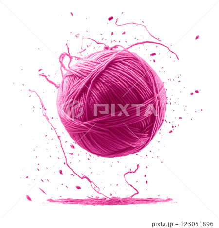 Pink yarn ball in midair with dynamic paint splashes, isolated on a transparent background. Floating fiber thread sphere with artistic splatter effect. 123051896