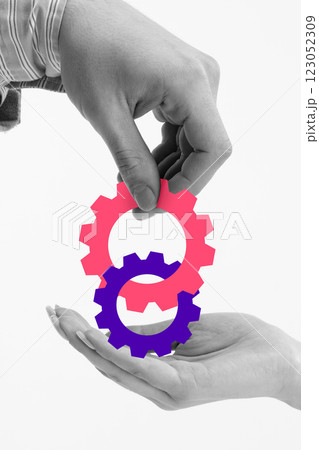 Two hands positioning interconnected gears, illustrating strategic planning, teamwork, and seamless integration of business processes. Two hands positioning interconnected gears, illustrating strategic planning, teamwork, and seamless integration of business processes. 123052309