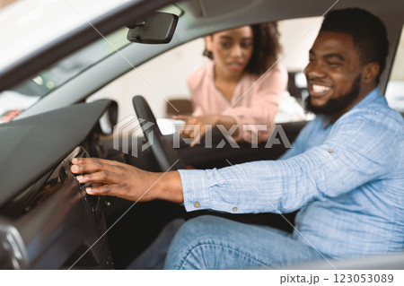 Buying Automobile. Family Couple Choosing New Car Testing Auto In Dealership Store. Shallow Depth, Selective Focus 123053089