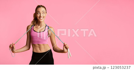Weight Loss Concept. Slim Young Lady Holding Measuring Tape On Yellow Studio Background. Free Space For Text 123053237