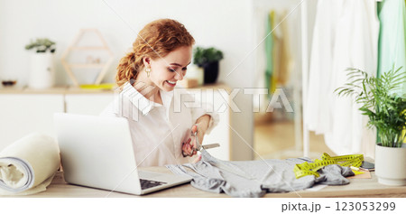 Successful tailor cutting grey fabric in own atelier, making customer's order, copy space 123053299