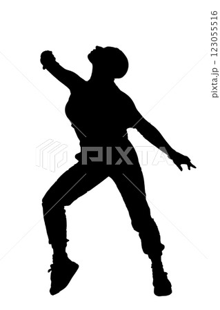 A silhouetted woman jumping in the air with arms outstretched 123055516
