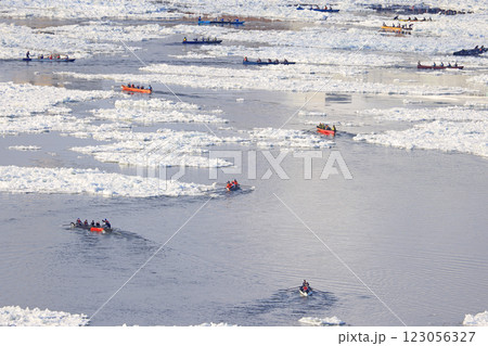 Aerial view of traditional Ice Canoe Race on frozen Saint Lawrence River from Quebec to Levis during Quebec winter Carnival Aerial view of traditional Ice Canoe Race on frozen Saint Lawrence River from Quebec to Levis during Quebec winter Carnival 123056327