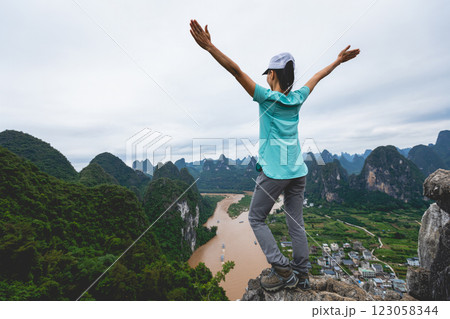 Woman tourist enjoy the beautiful landscape of yangshuo county, China 123058344