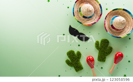 Cinco de Mayo holiday background made from maracas, mexican blanket stripes or poncho serape, cactus and hat on pastel background. 123058596