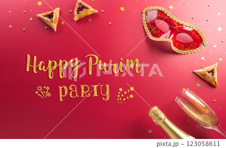 Happy Purim carnival decoration concept made from golden mask star and glitter on red background. (Happy Purim in Hebrew, jewish holiday celebrate) 123058611