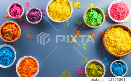 Happy Holi decoration, the indian festival.Top view of colorful holi powder on dark blue background. Happy Holi decoration, the indian festival.Top view of colorful holi powder on dark blue background. 123058614