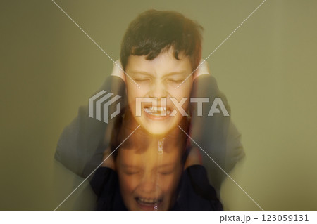 Teenager with psychological problem is screaming holding his ears. 123059131
