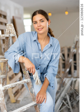 Portrat of cheerful young woman inside construction site Portrat of cheerful young woman inside construction site 123060616