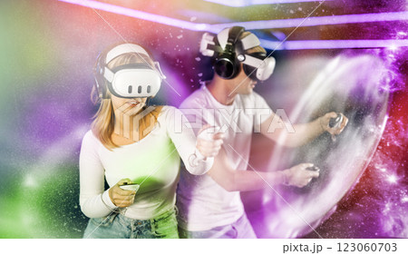 Guy and girl playing against another couple in a game 123060703