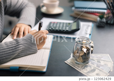 Finance bank tax expense accounting budget money businessman hand use calculator Financial calculate accountant close up calculator with graph chart write office desk Business expense analysis saving Finance bank tax expense accounting budget money businessman hand use calculator Financial calculate accountant close up calculator with graph chart write office desk Business expense analysis saving 123062429