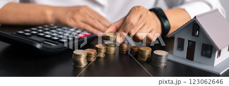 Finance bank tax expense accounting budget money businessman home for Business expense analysis saving use Financial calculate accountant close up calculator with graph chart hand write office desk 123062646