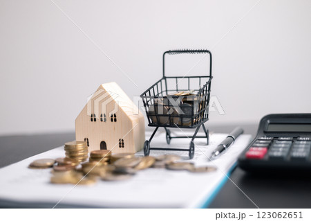 Finance bank tax expense accounting budget money businessman home for Business expense analysis saving use Financial calculate accountant close up calculator with graph chart hand write office desk 123062651