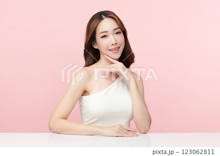 Beautiful young asian woman with clean fresh skin on pink background, Face care, Facial treatment, Cosmetology, beauty and spa, Asian women portrait. 123062811